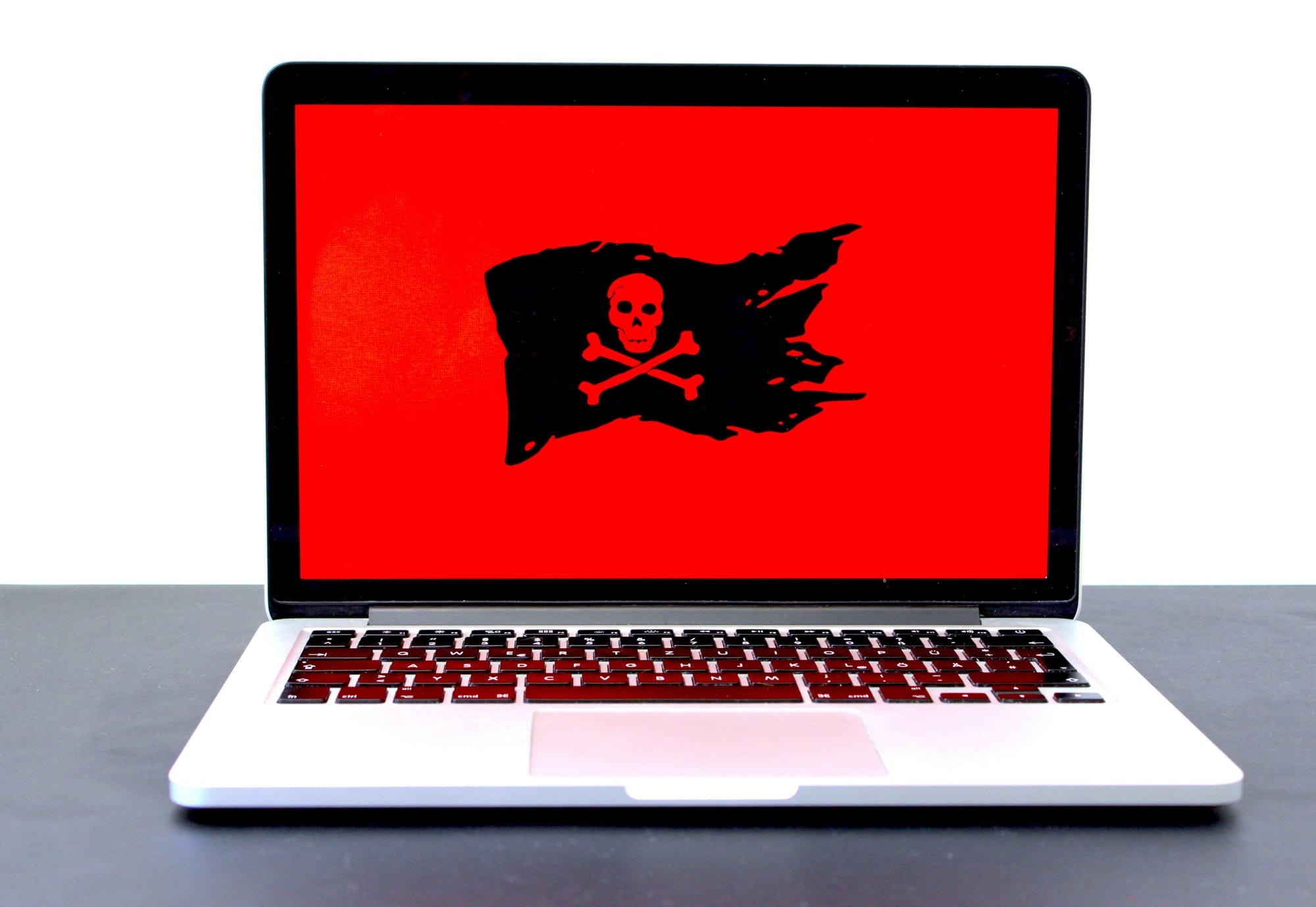 Phishing warning sign with a red screen skull and bone icon and a torn flag